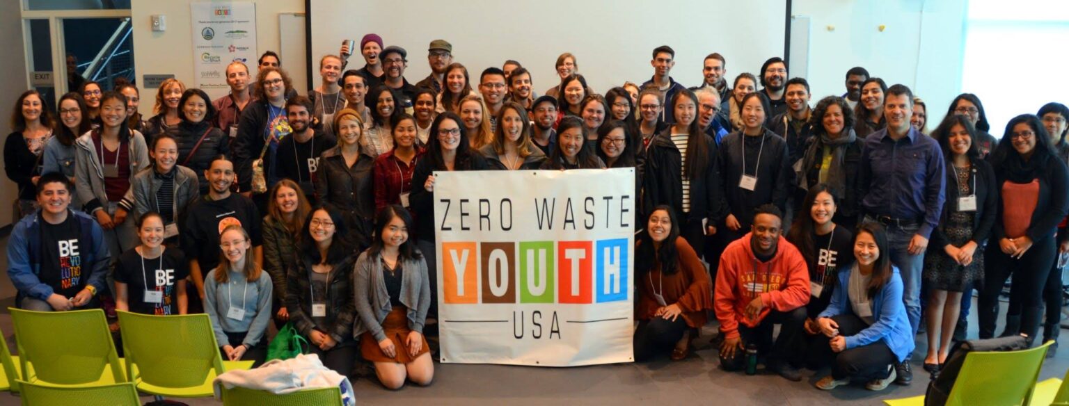 Young people gathered around a sign said Zero Waste Youth USA